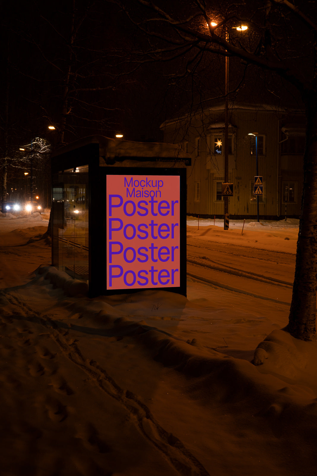 PSD mockup of a bus stop poster display at night, illuminated under streetlights on a snowy street.