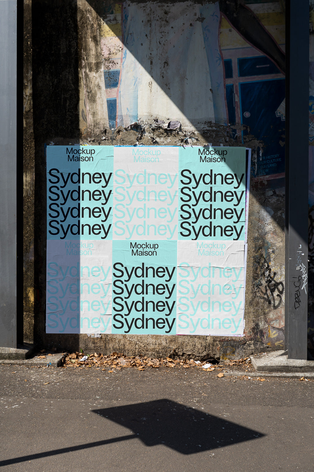 PSD mockup of multiple "Sydney" posters displayed on a weathered wall, creating a tiled effect with alternating light blue and white backgrounds.