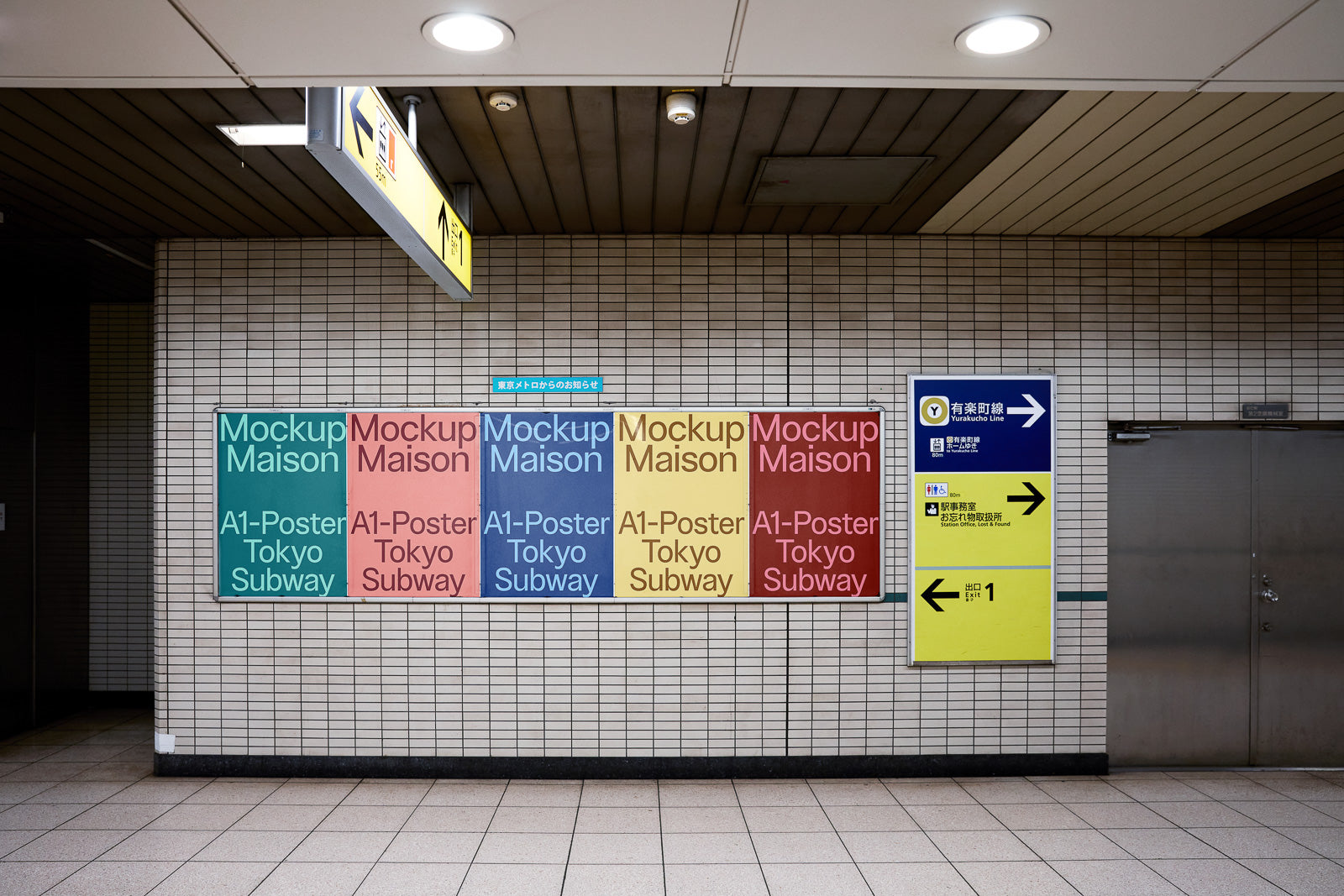 PSD mockup of A1 posters displayed on a tiled subway wall with various colors, alongside directional signs for Yurakucho Line.
